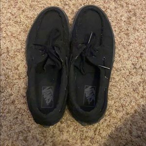 All black boat shoes vans